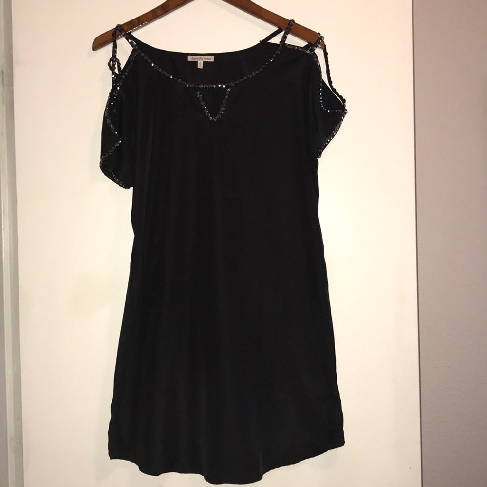 Short black dress with shoulder detail